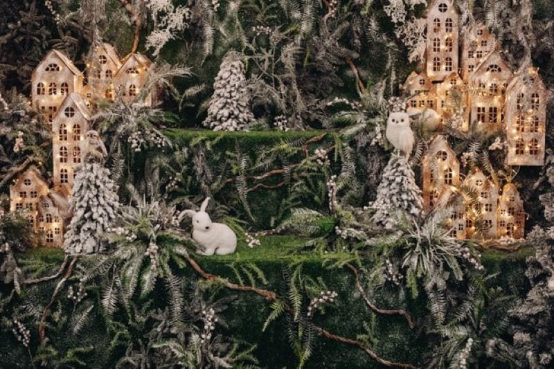 What distinguishes unlit and pre-lit artificial Christmas trees?